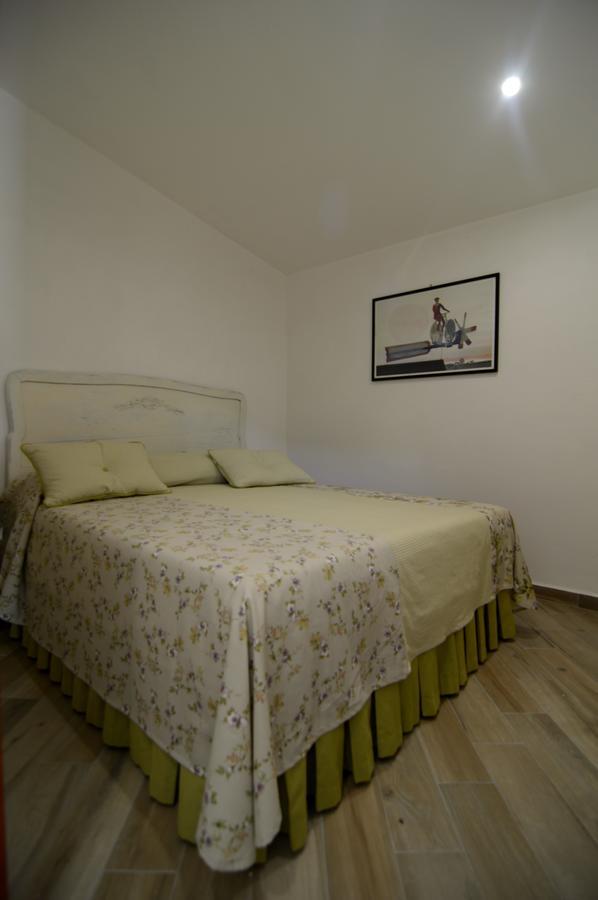 Camera Familiare con Vista Giardino